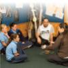 Image of teacher and students. 